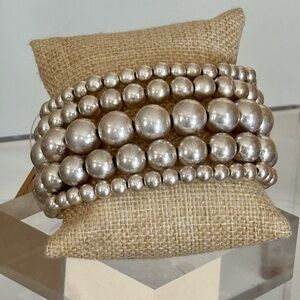 Big beads multi-strand silver tone stretchy bracelet
NEVER WORN